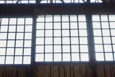 The facade of the old hangar inside with Windows Stock Photos