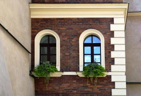 Facade of an old house with arc windows Stock Photos