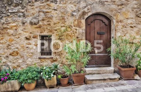 Facade of the old house in village France Stock Photos