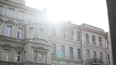 Facade of old nice beige building with several windows and rain gutter pipe Stock Footage 107111529