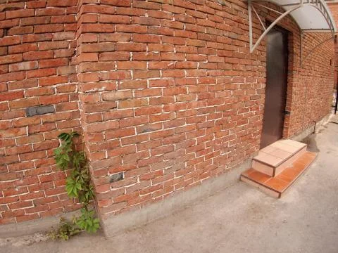 The facade of the old red brick Stock Photos