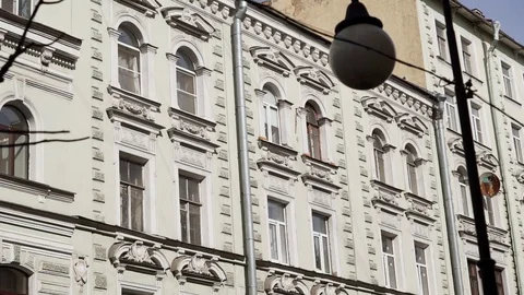Facade of old Soviet Union time building with several windows and gutter pipe Stock Footage 107112099