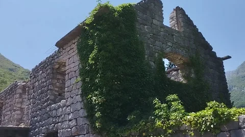 Facade of an old stone mill building in the mountains Stock Footage 199769975