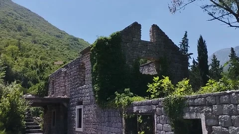 Facade of an old stone mill building in the mountains Stock Footage 199770094