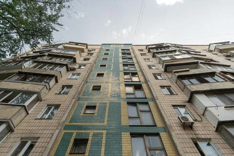 Facade of a panel apartment building of a Soviet house Stock Photos