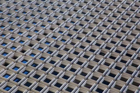  Facade Pattern Square windows form a geometric pattern on a skyscraper fa... Foto stock