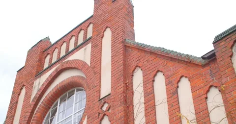 Facade of Red Building with Large Round Window in the Center  Vídeos de archivo 130239169