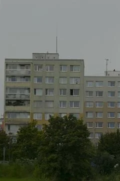 Facade with repeated windows and antennas reflects historic planning ideas Stock Photos