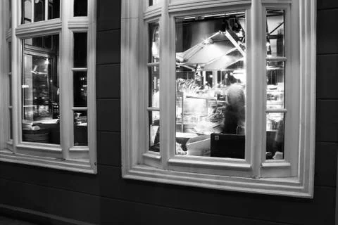 Facade of restaurant and view of interior through window Stock Photos