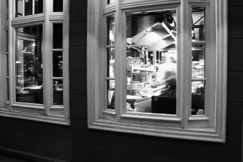 Facade of restaurant and view of interior through window Stock Photos