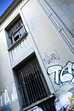 Facade of a squat in town Stock Photos