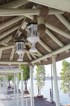 The facade of the summer gazebo with decorative elements and lamps for ligh.. Stock Photos