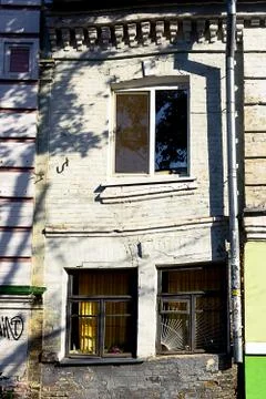 Facade of the two-storey white brick building Stock Photos