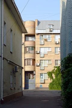 Facade of the two-storey white brick building Stock Photos