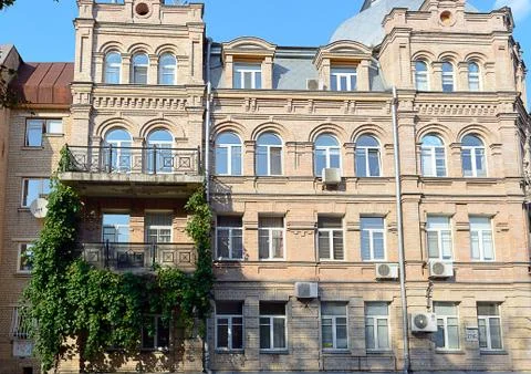 Facade of the two-storey white brick building Stock Photos