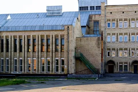 Facade of the two-storey white brick building Stock Photos