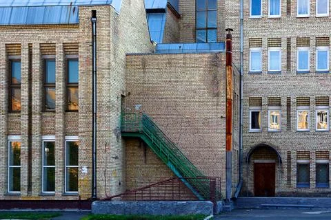 Facade of the two-storey white brick building Stock Photos