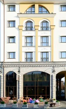 Facade of the two-storey white brick building Stock Photos