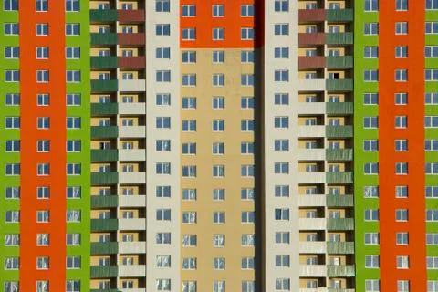 The facade of a typical block multi-storey residential building. Front view Stock Photos