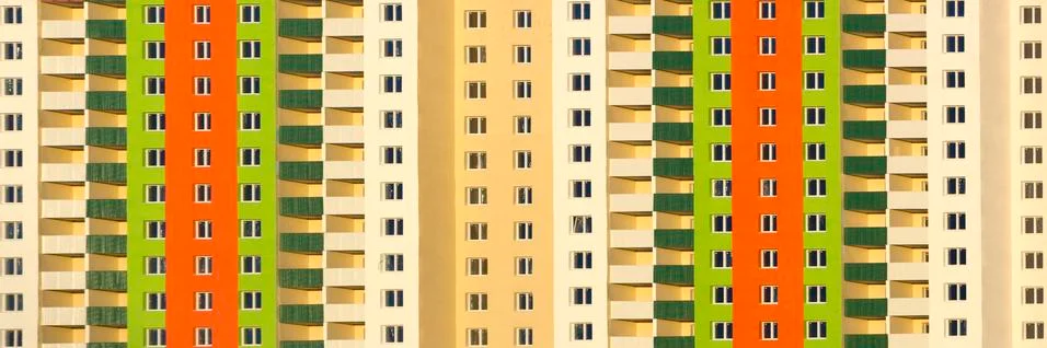 The facade of a typical block multi-storey residential building. Front view Stock Photos