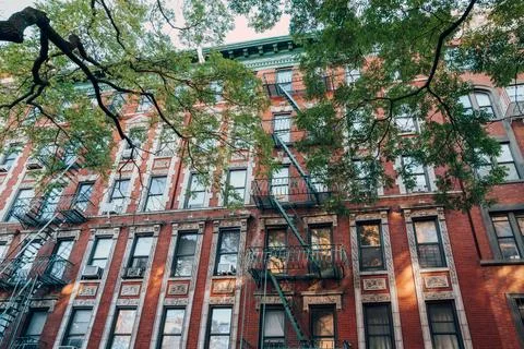 Facade of a typical New York block of flats with fire escape at the front, US Stock Photos