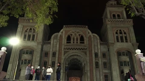 Facade of an unfinished cathedral in the main square of Huaras at night with Stock Footage 164572750