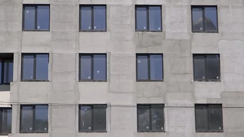 Facade of an unpainted building, still under renovation, background view Stock Footage 130182623