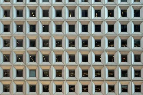 Facade of urban skyscraper rows of square geometric pattern windows Geomet... Stock Photos