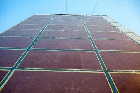 The facade of the wall of a multi-storey building of panels decorated with mo Stock Photos