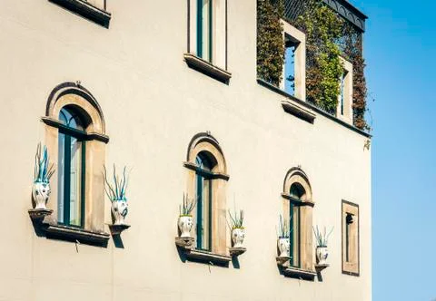 Facade wall of old baroque building in Taormina, traditional architecture of  Stock Photos