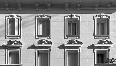 Facade of a white building made Stock Photos