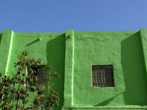 Facade with window painted green Stock Photos