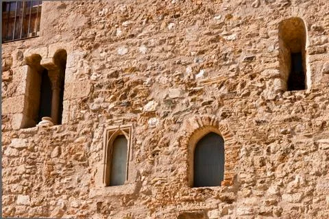 Facade with windows in the romanesque monastery of Sant Cugat Stock Photos