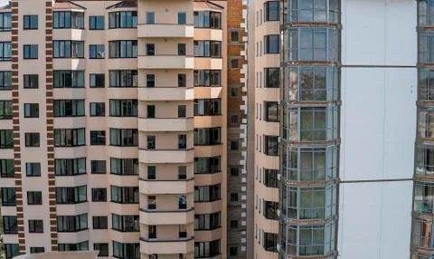 Facade work and insulation of a multistory building. Stock Photos