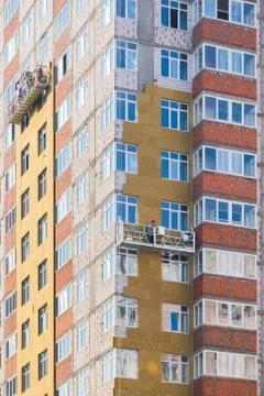 Facade work and insulation of a multistory building Stock Photos