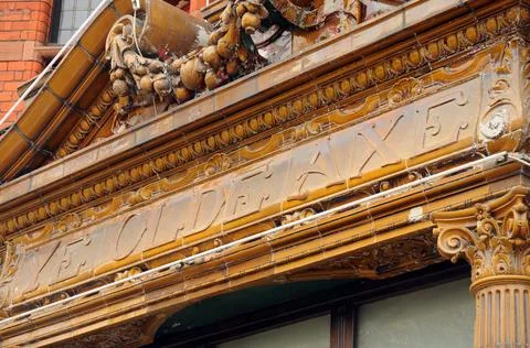 Facade of the Ye Olde Axe strip pub in London, UK. Stock Photos