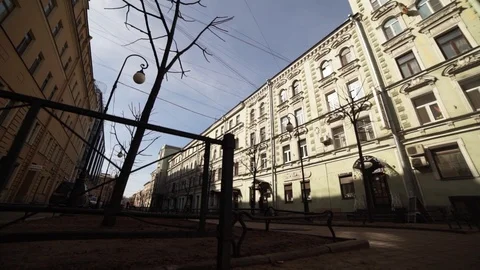 Facades of two old beige and orange buildings with several windows on sunny day Stock Footage 107112265