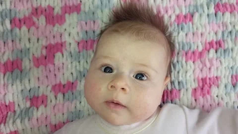 The Face Of An Active Three-Month-Old Baby Stock Footage 273973215