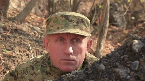 Face of  aim Soldier with automatic rifle     Stock Footage 69879219