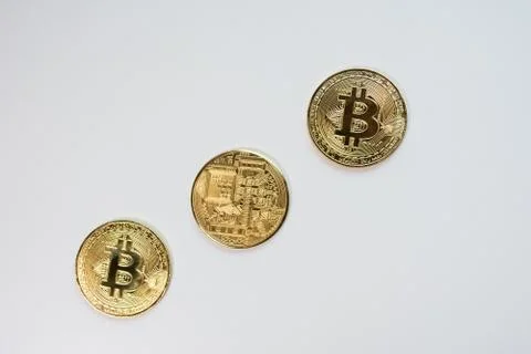 Face and back of the crypto currency golden bitcoin isolated on white backgro Foto stock