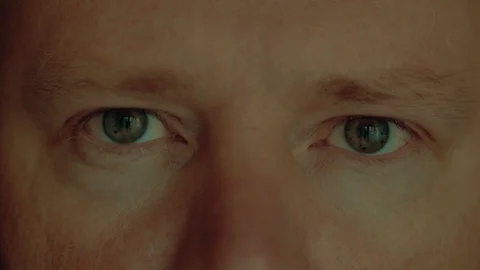 Face and eyes of a man close up, slow motion Stock Footage 127948423