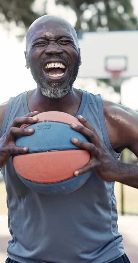 Face, angry and black man with ball for basketball, practice match and Stock Footage 340893334