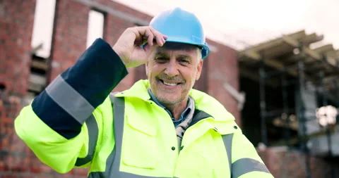 Face, architect and happy man at construction site with helmet, development or Stock Footage 337027351