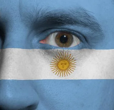 Face with the argentinian flag painted on it Stock Photos