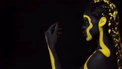 Face Art Woman With Black And Yellow Body Paint Young African Girl