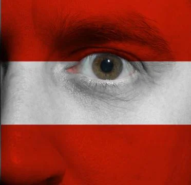 Face with the austrian flag painted on it Stock Photos