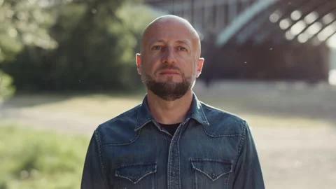 Face of bald handsome and confident man with a stylish beard is standing in the Stock Footage 144381932