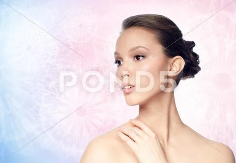 Face of beautiful asian woman with golden ring Stock Photos
