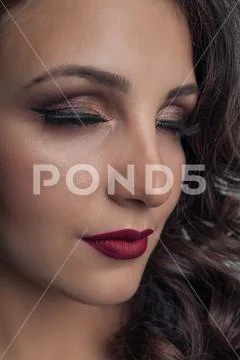 Face of a beautiful multi-ethnic girl close-up. Beautiful make-up Stock Photos