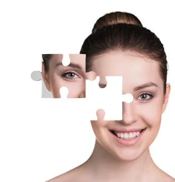 Face of  beautiful young woman with a puzzle parts Stock Photos
